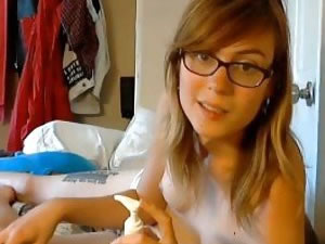Cute shemale chick in sexy glasses posing on webcam